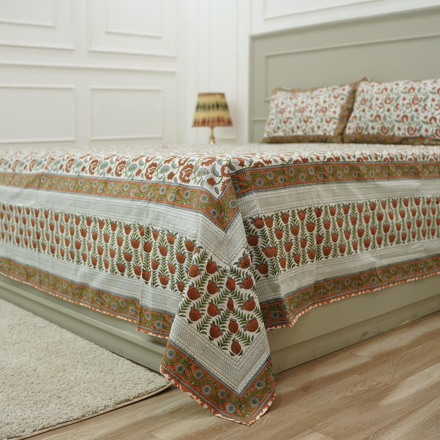 Infuse your bedroom with the delicate art of wooden block printing. This cotton bedsheet and pillow cover set showcases timeless floral patterns, hand-pressed to ensure authenticity and charm in every inch.